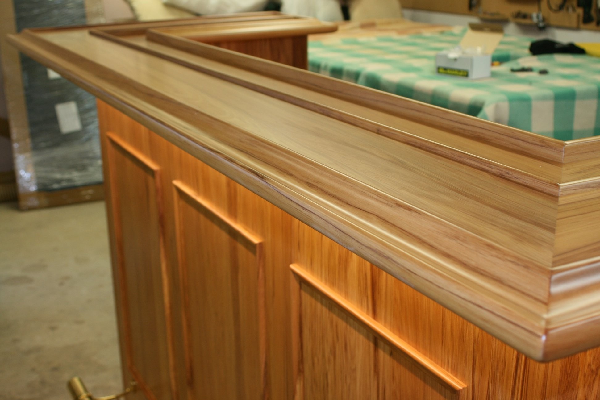 LShaped Bar  with brass footrail, led strip lights, fridge and drawers.
