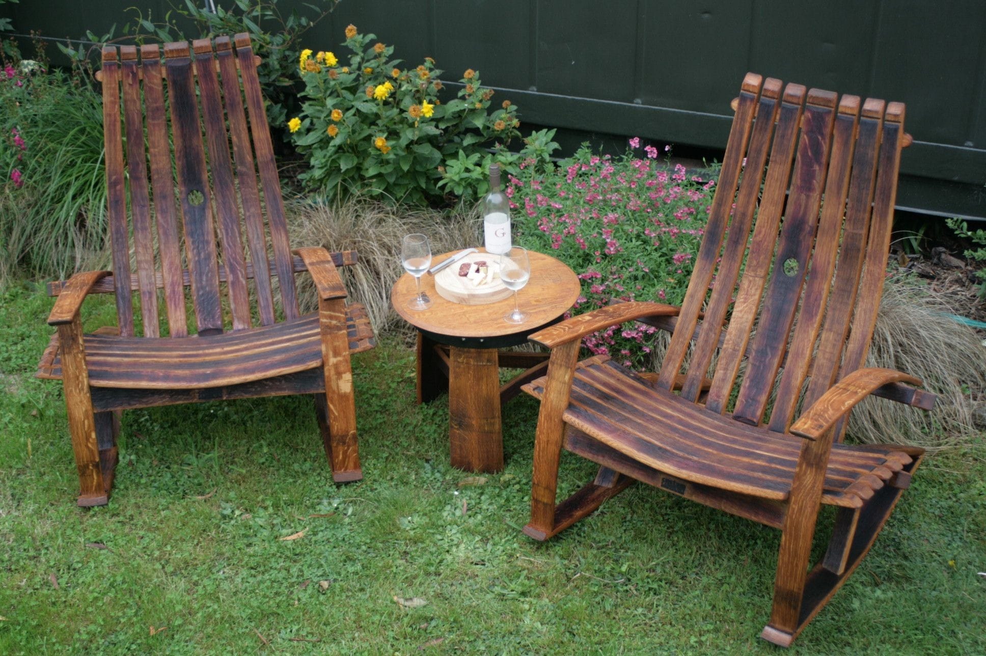Outdoor furniture made from used wine barrels.