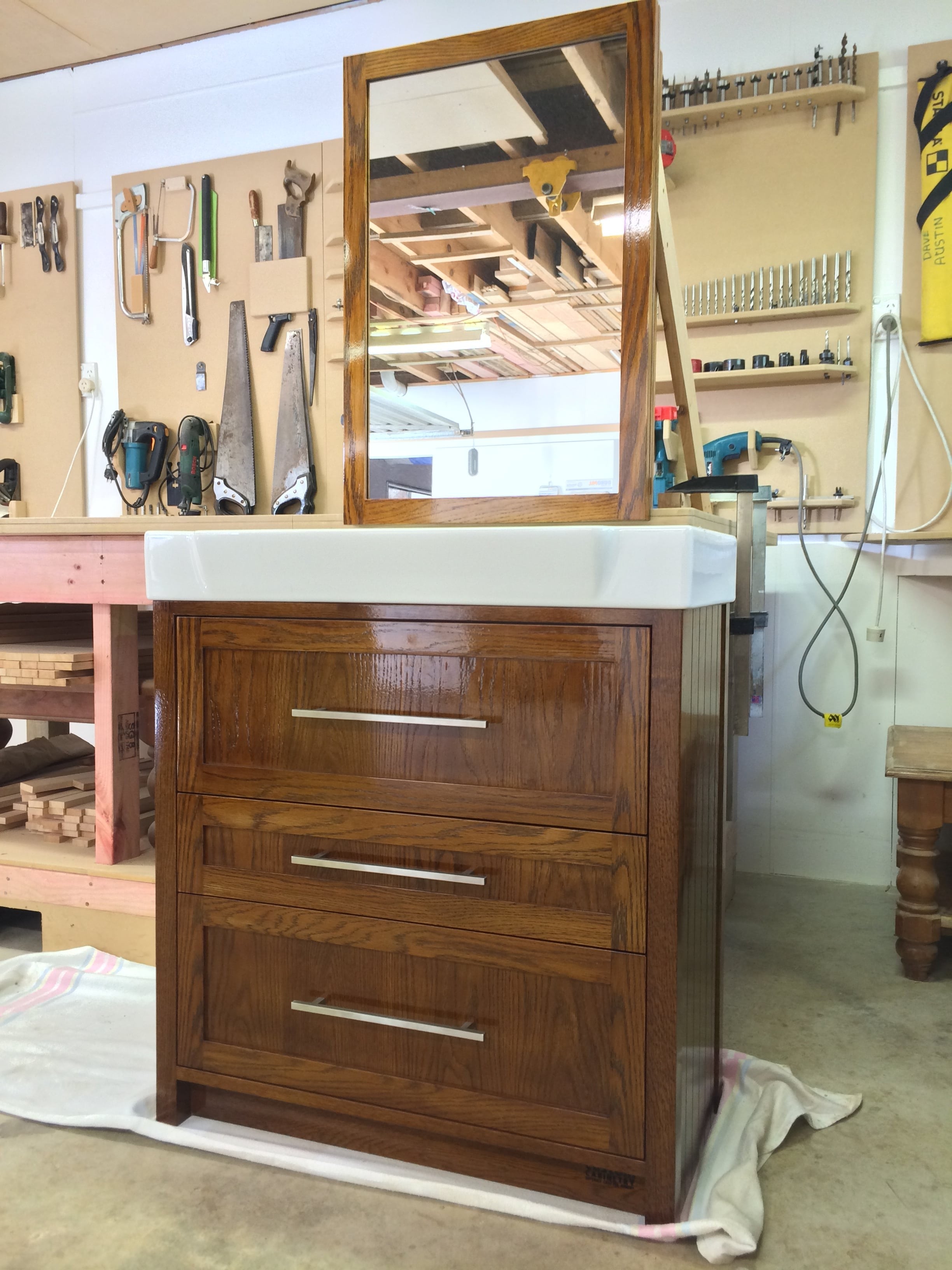 Stained Oak Vanity with Mirrored wall cabinetr above